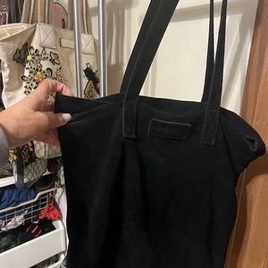 This is a beautiful black suede tote by Beryll! Its in beautiful condition